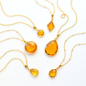 Shop our citrine necklace collection available in large, medium and small teardrops, prong set teardrop, prong set diamond, large and medium rounds on white background. Choose from satellite or cable chain. November birthstone. White background