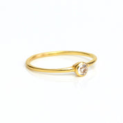 Single gold plated dainty 3mm clear quartz gemstone ring. april  birthstone. On white background. 925 sterling silver, birthstone ring, stacking ring, stackable, birthstone jewelry, facet gemstone