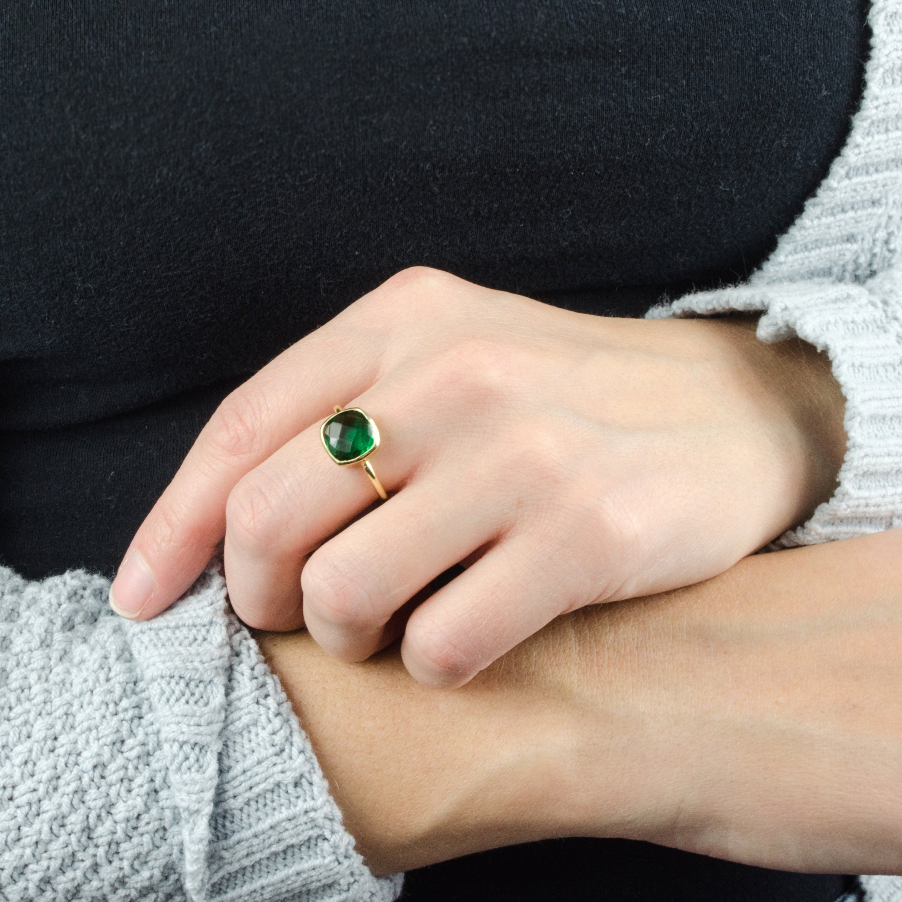 Model is wearing a Emerald Quartz gold plated cushion bezel set square stacking ring 