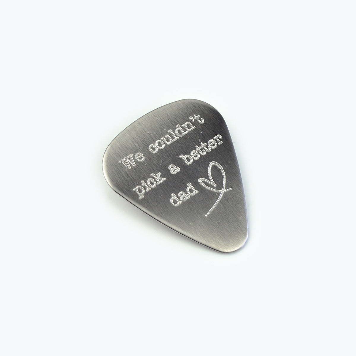 Guitar pick engraved with a special message to dad and a on white background. Father's day gift, birthday gift. 