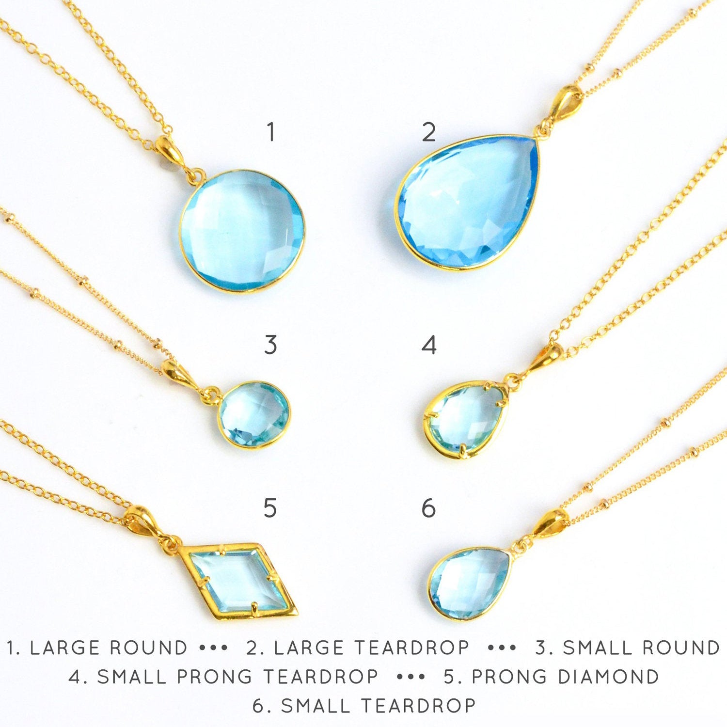 Shop our blue topaz necklace collection available in large, medium and small teardrops, prong set teardrop, prong set diamond, large and medium rounds on white background. Choose from satellite or cable chain. December birthstone. 