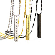Three 3d Bar necklaces in silver with coordinates in block font, gold with a custom phrase in modern thin font, or black with names engraved in typewriter font.