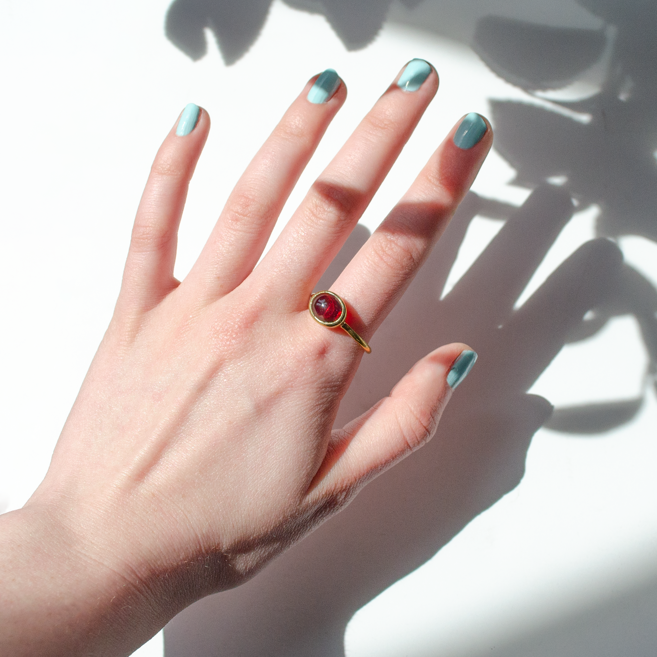 garnet-cabochon-ring-on-hand.png