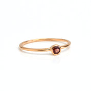Single rose gold plated dainty 3mm garnet gemstone ring. January birthstone. On white background. 925 sterling silver, birthstone ring, stacking ring, stackable, birthstone jewelry, facet gemstone
