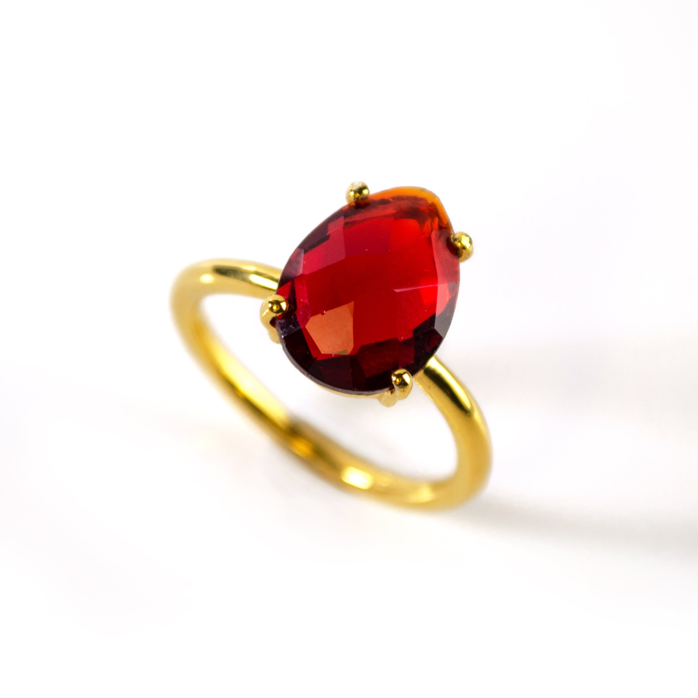 garnet-prong-teardrop-gold-ring-0.jpg