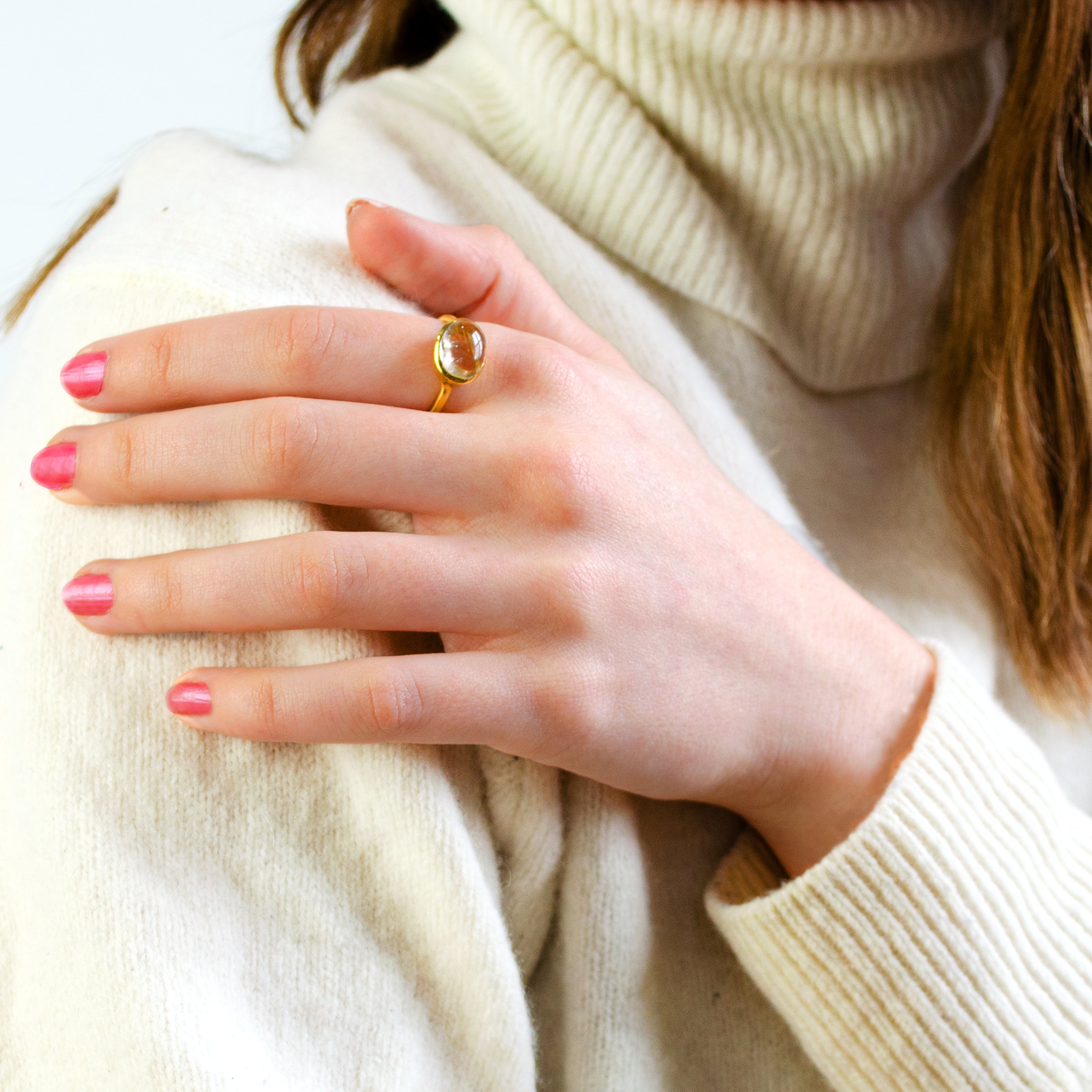 golder-rutilated-quartz-oval-ring-on-hand.jpg