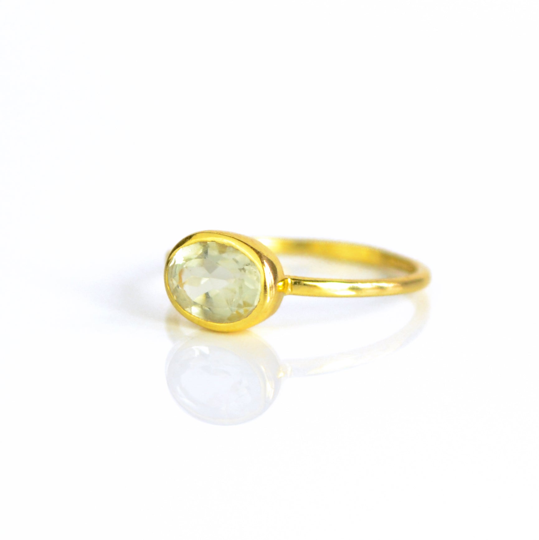 a gold green amethyst ring shown on white background. green gemstone, green birthstone, february birthstone, february gemstone, stack set, stacking rings, gemstone ring, birthstone ring, mother's day gift for her, gift for mom, gift for fiance, gift for girlfriend, wedding jewelry, bridesmaid jewelry, anniversary jewelry, anniversary gift, birthday gift, christmas gift, valentine's day gift, valentine's day rings, dainty ring, cocktail ring, statement ring, bezel set