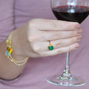 Model is wearing a gold plated green onyx cushion square ring. Green Onyx gold plated cushion bezel square stacking ring on white background. may birthday, may gemstone square gemstone, green birthstone, green gemstone, may, sterling silver ring, may ring