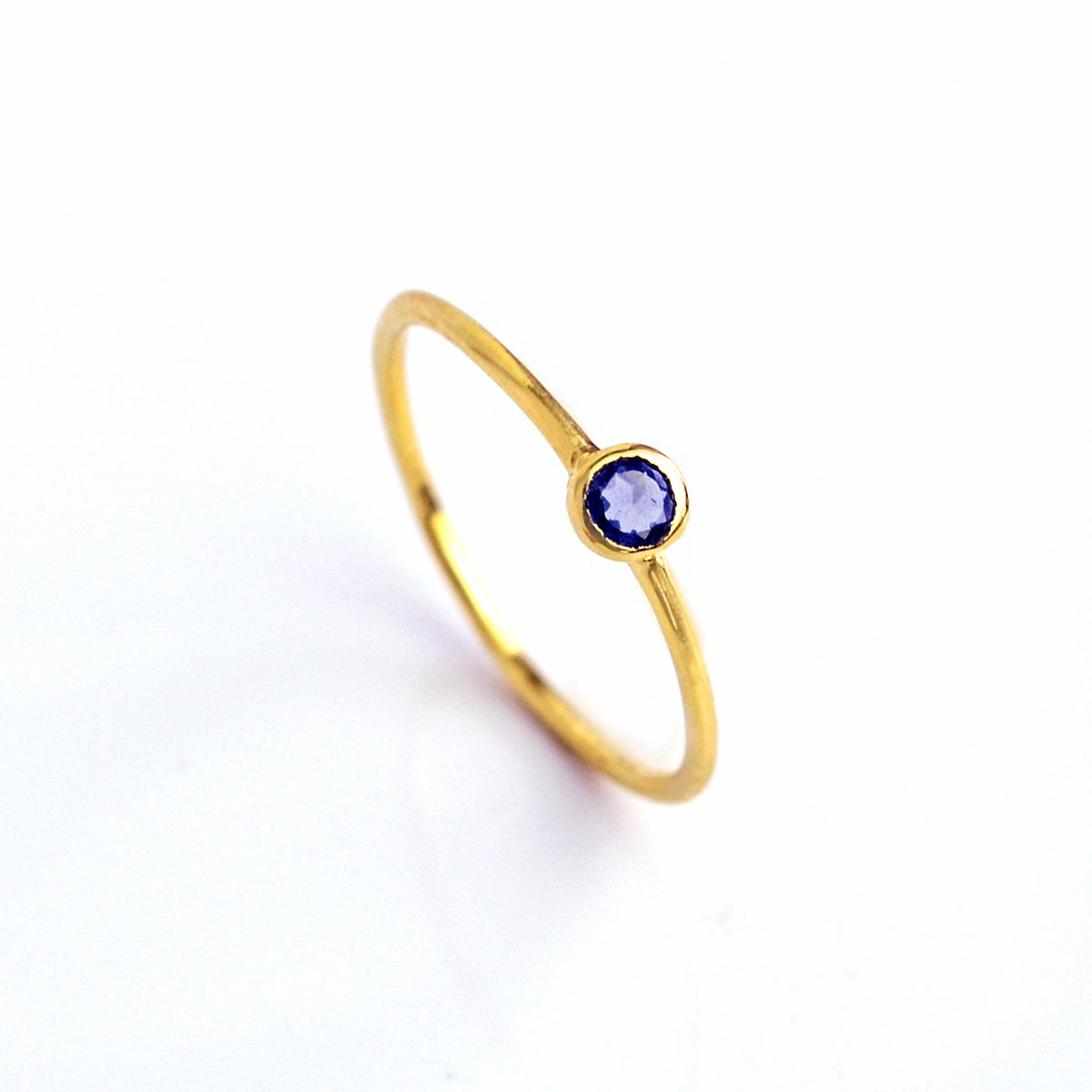 Single gold plated dainty 3mm Kyanite gemstone ring. September  birthstone. On white background. 925 sterling silver, birthstone ring, stacking ring, stackable, birthstone jewelry, facet gemstone