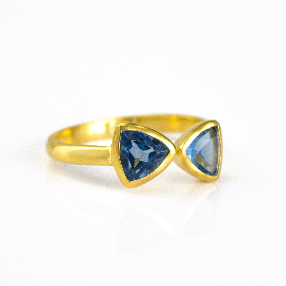 A gold kyanite ring. Adjustable Kyanite Quartz triangle ring, Kyanite bow tie ring, personalized Kyanite jewelry, sterling silver Kyanite triangle ring, gold Kyanite ring, rose gold Kyanite Quartz ring, unique blue Kyanite, September birthstone jewelry, triangle-cut Kyanite Quartz, custom gemstone ring, chic Kyanite jewelry, bespoke blue gemstone ring, Kyanite stacking ring, elegant triangle ring, trendy Kyanite accessory, custom Kyanite gift, adjustable bow tie ring, unique Kyanite jewelry, blue Kyanite