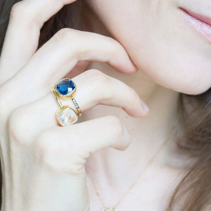 Model stylishly stacking the kyanite and clear quartz gold plated cushion bezel pave square stacking ring. . aqua chalcedony march birthday, march gemstone, white topaz, stacking ring, stackable, ring stack, square bezel set, bezel setting