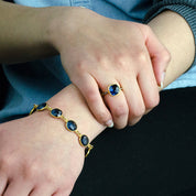 Model is wearing the Kyanite gold plated cushion bezel square White topaz pave stacking ring and matching 10mm kyanite gemstone bracelet.