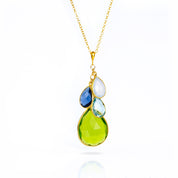 Single gold filled cable style cascade chain with large mother's peridot birthstone and three kid's stones including moonstone, kyanite and blue topaz
