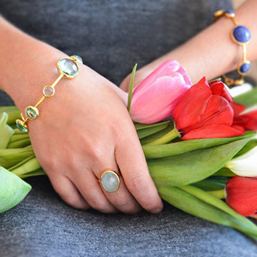 large_march_birthstone_oval_bezel_ring_on_hand_f5fd0505-5998-4f54-8760-8dd9ddb363b6.jpg