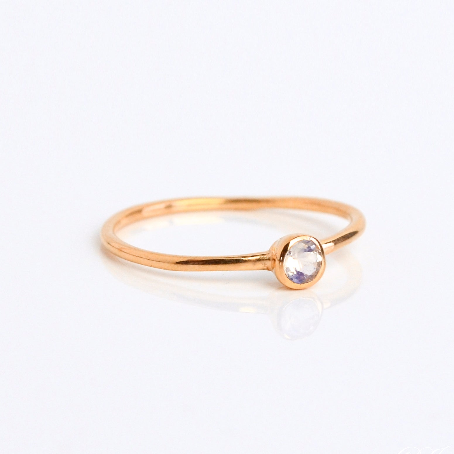 Single rose gold plated dainty 3mm Opalite gemstone ring. October  birthstone. On white background. 925 sterling silver, birthstone ring, stacking ring, stackable, birthstone jewelry, facet gemstone