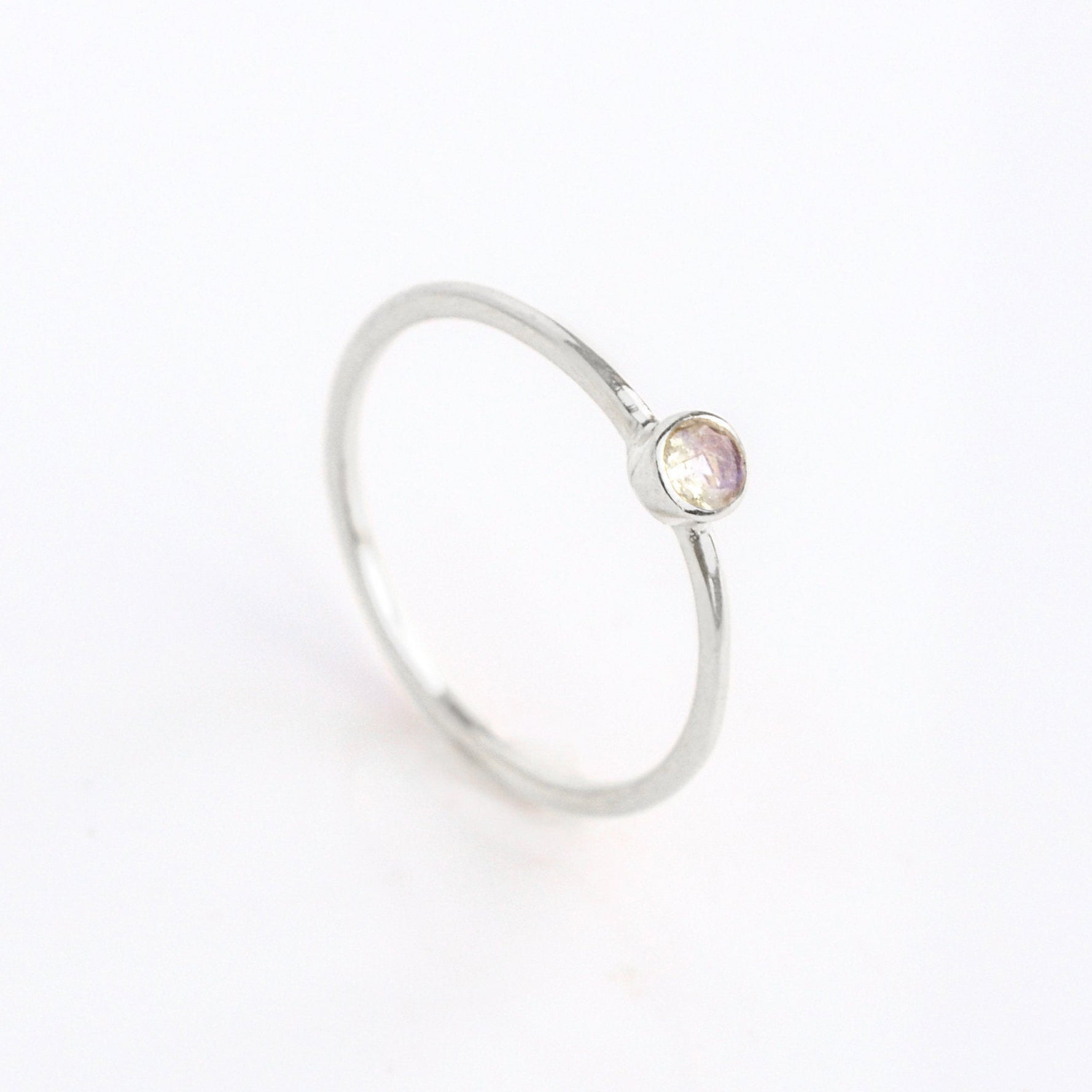sterling silver dainty 3mm Opalite gemstone ring. October birthstone. On white background. 925 sterling silver, birthstone ring, stacking ring, stackable, birthstone jewelry, facet gemstone