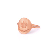 Rose gold custom engraved paw print ring with typewriter font and name Snoops.