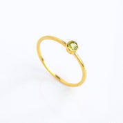 Single gold plated dainty 3mm peridot gemstone ring. august  birthstone. On white background. 925 sterling silver, birthstone ring, stacking ring, stackable, birthstone jewelry, facet gemstone