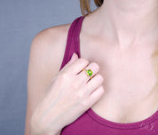 model wearing Peridot gold plated cushion bezel square stacking ring 