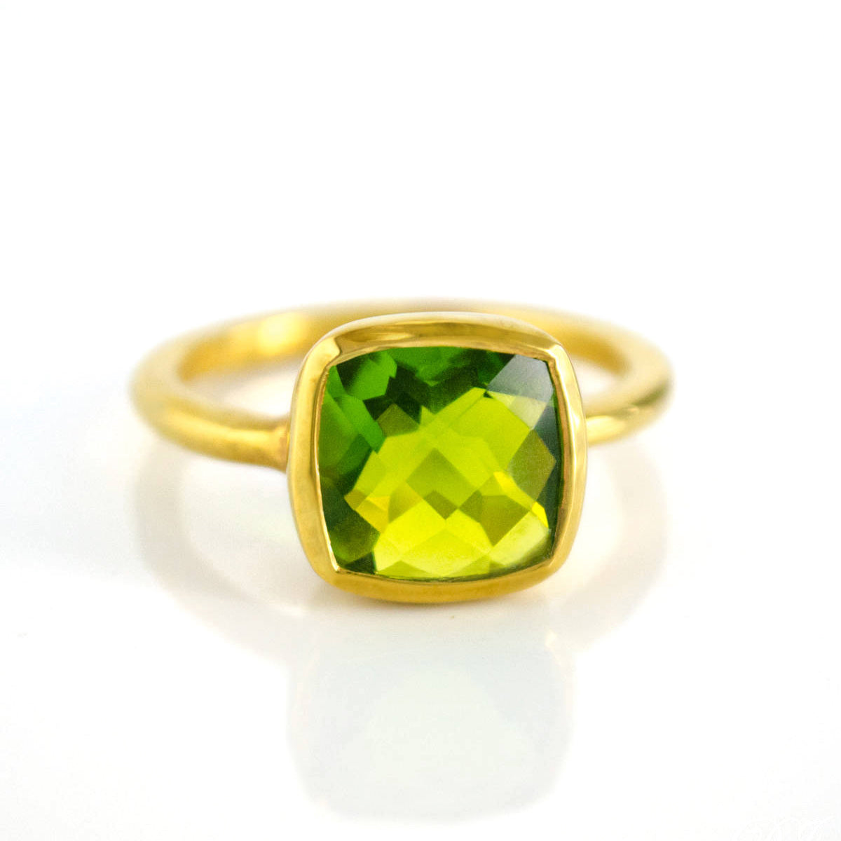 Peridot gold plated cushion bezel square stacking ring on white background. August birthday, august gemstone, square gemstone, green stone, green ring, august birthstone, sterling silver ring