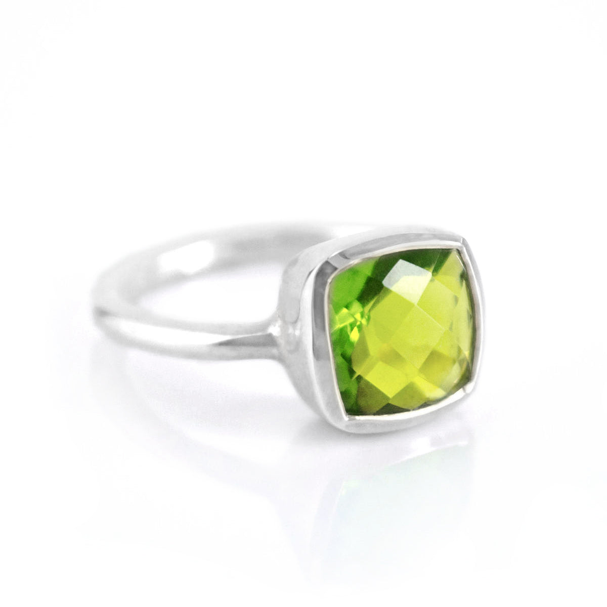 Sterling silver Peridot cushion bezel square stacking ring on white background. August birthday, august gemstone, square gemstone, green stone, green ring, august birthstone, sterling silver ring