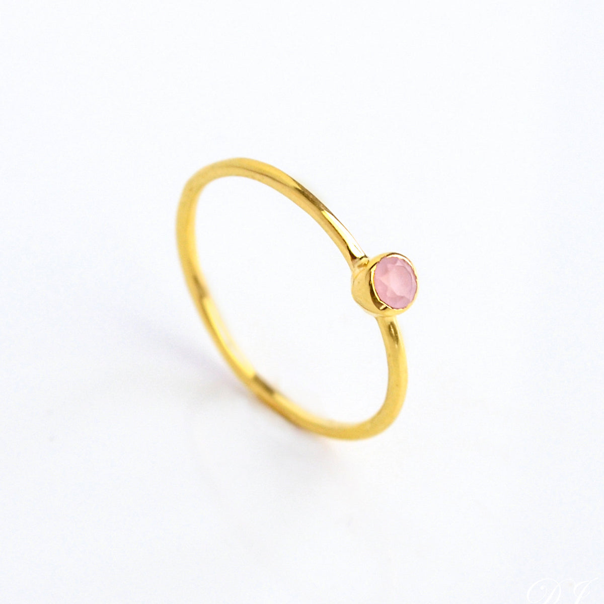 Single gold plated dainty 3mm pink chalcedony gemstone ring. October  birthstone. On white background. 925 sterling silver, birthstone ring, stacking ring, stackable, birthstone jewelry, facet gemstone