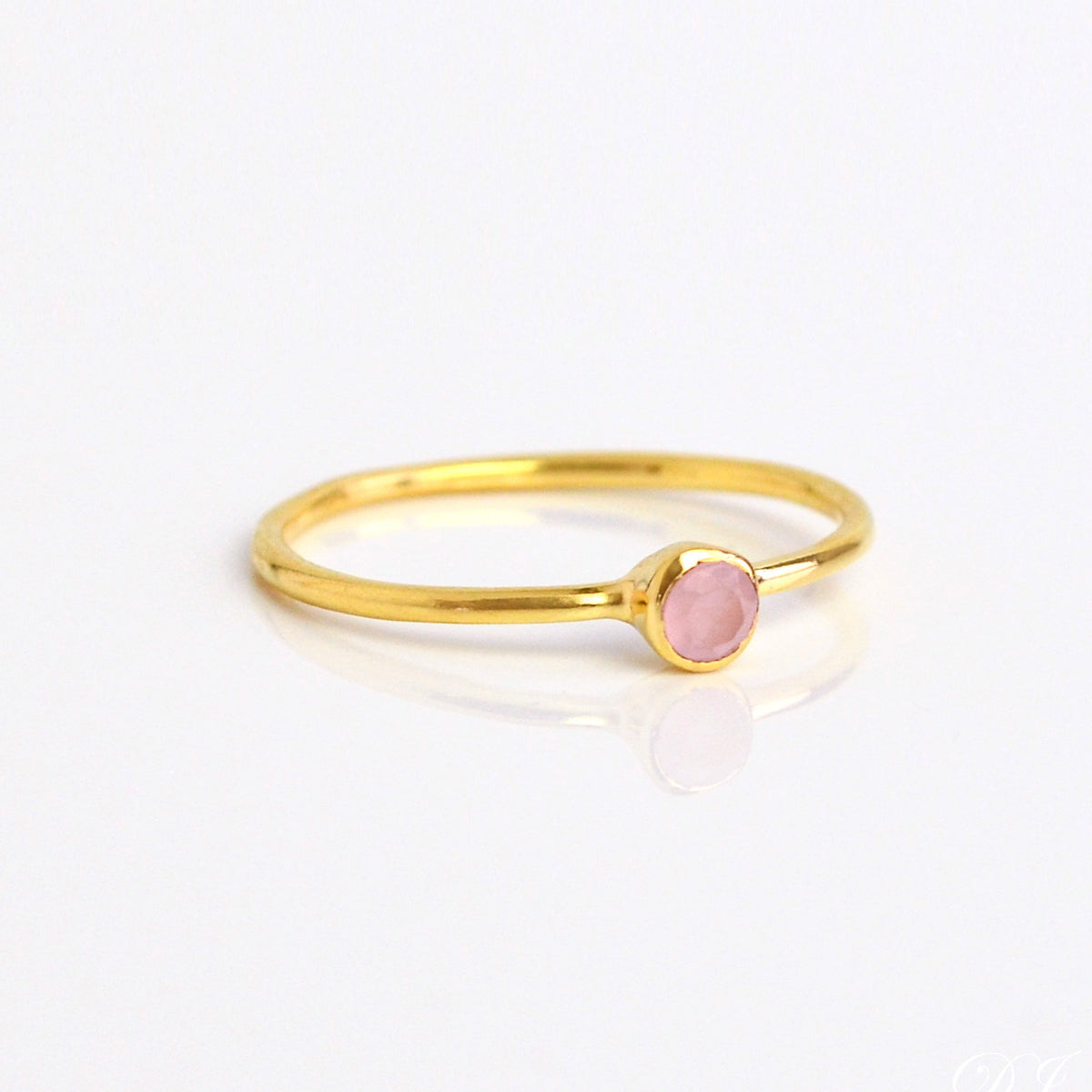 Single gold plated dainty 3mm pink chalcedony gemstone ring. October  birthstone. On white background. 925 sterling silver, birthstone ring, stacking ring, stackable, birthstone jewelry, facet gemstone