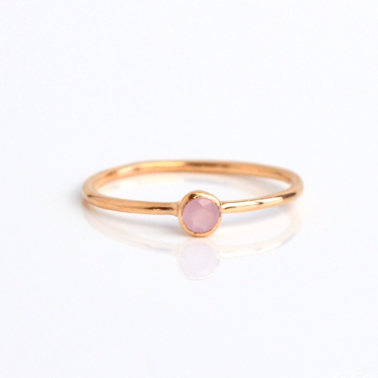 Single rose gold plated dainty 3mm pink chalcedony gemstone ring. October  birthstone. On white background. 925 sterling silver, birthstone ring, stacking ring, stackable, birthstone jewelry, facet gemstone