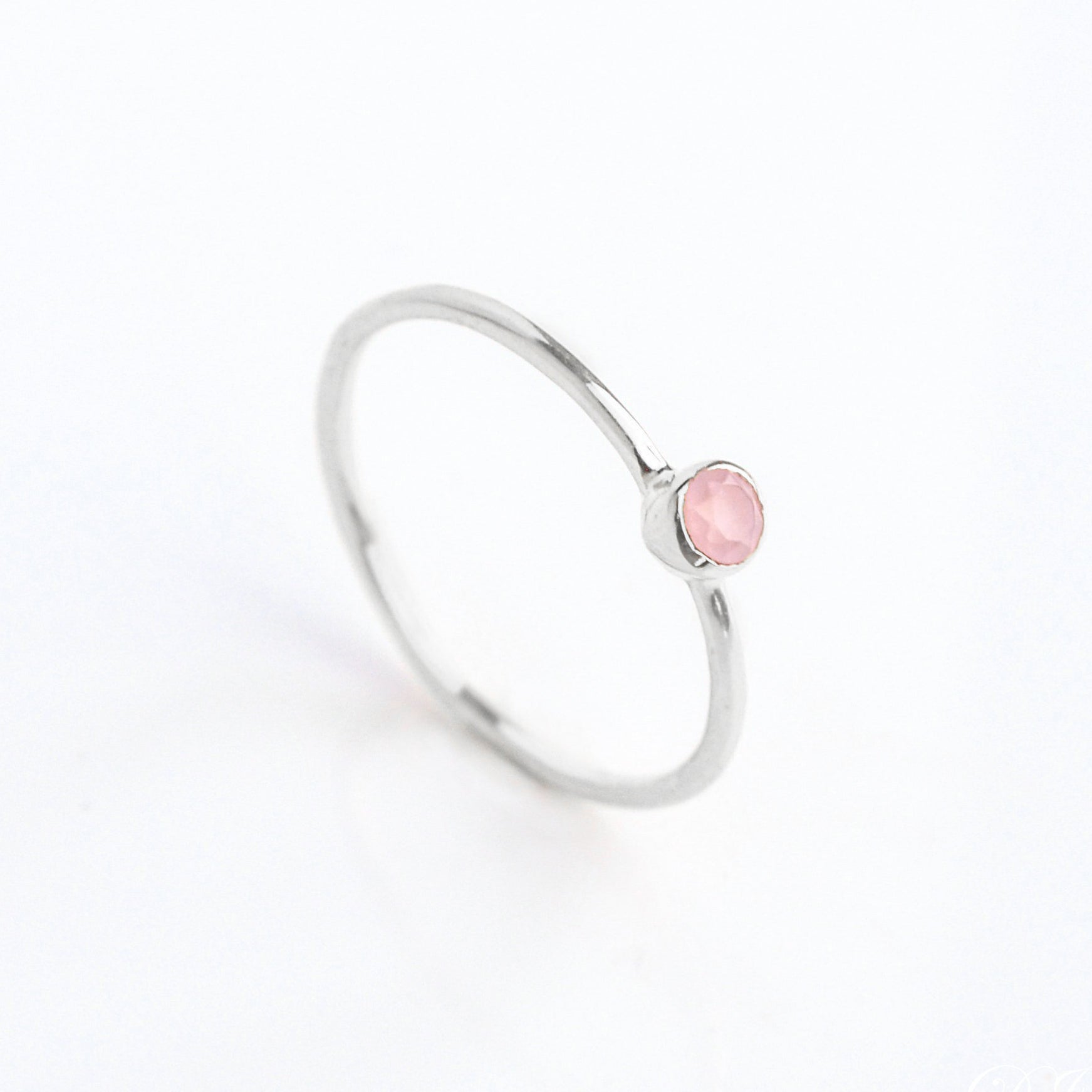 sterling silver dainty 3mm pink chalcedony gemstone ring. October  birthstone. On white background. 925 sterling silver, birthstone ring, stacking ring, stackable, birthstone jewelry, facet gemstone