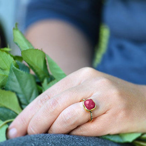 Model is wearing a Ruby gold plated cushion bezel square White topaz pave stacking ring. July birthday, July gemstone, square gemstone, sterling silver, red birthstone, red ring