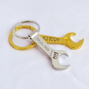 Single gold toned wrench keychain with special GPS coordinates engraved and a heart emoji. Single silver tone wrench keychain engraved with special message. bottle opener keychain