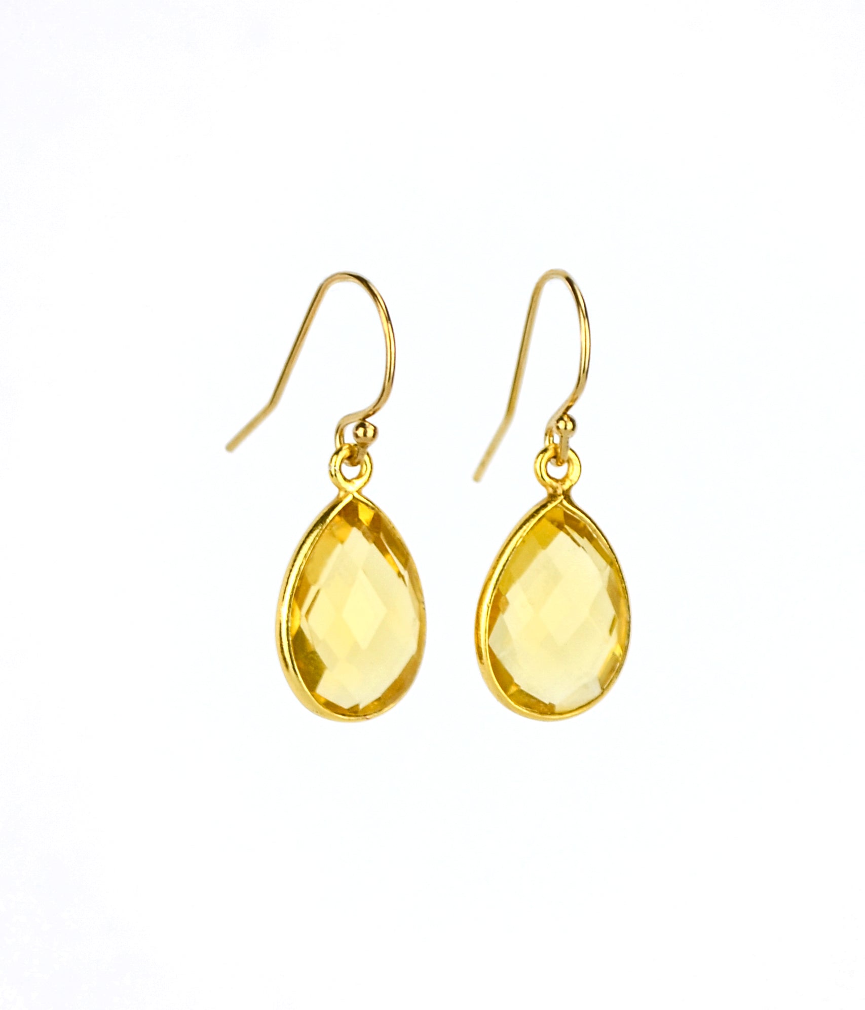 Small gold filled hook teardrop citrine gemstone earrings. November birthstone on white background