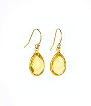 Small gold filled hook teardrop citrine gemstone earrings. November birthstone on white background