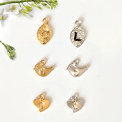 Charm options include leaf (default) baby birds or hearts. 