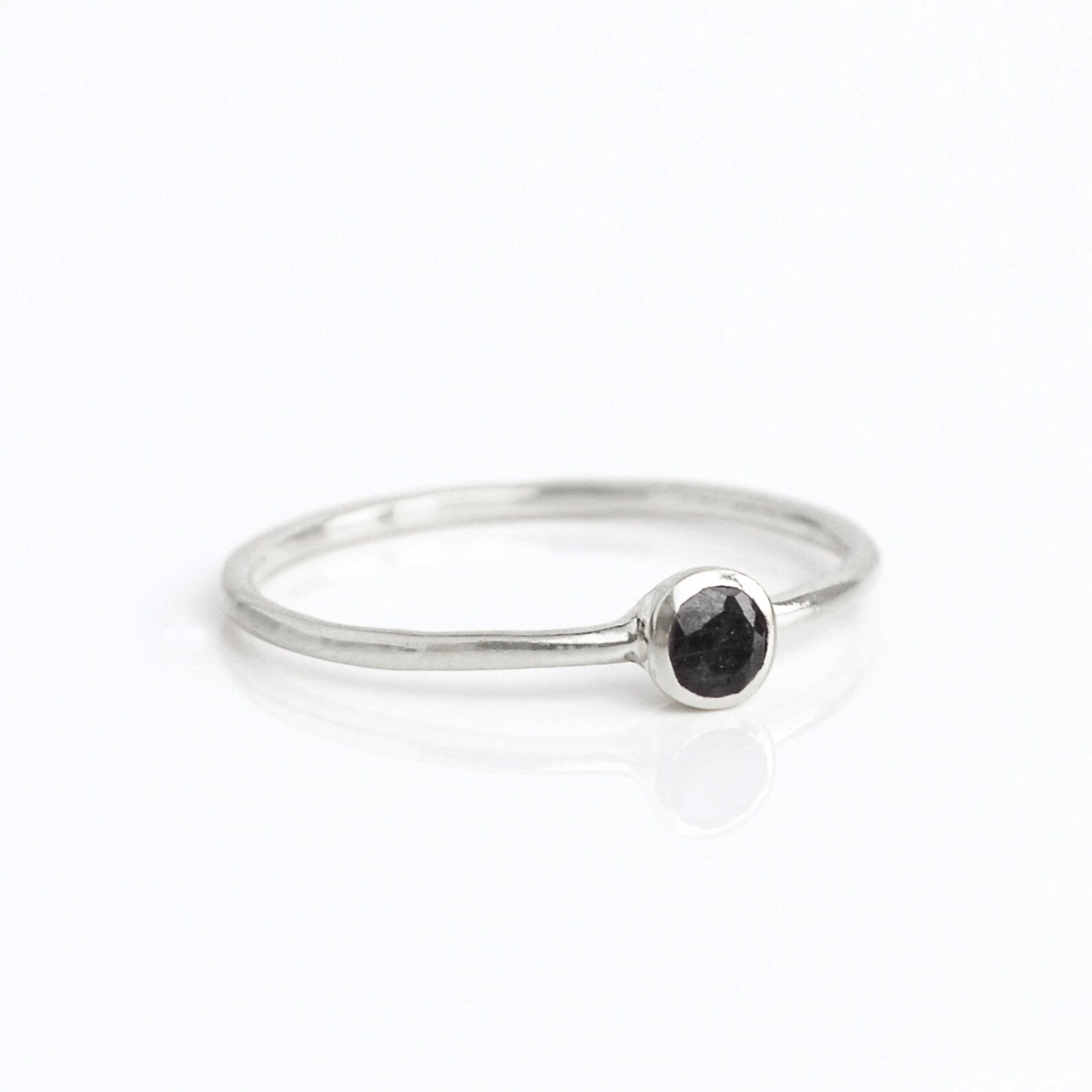 sterling silver dainty 3mm black onyx gemstone ring. december birthstone. On white background. 925 sterling silver, birthstone ring, stacking ring, stackable, birthstone jewelry, facet gemstone