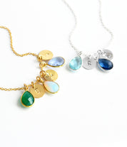 Gold cable chain with three birthstones green onyx, moonstone and alexandrite, sterling silver birthstone necklace with stamped polished disk with blue topaz and kyanite birthstones. 