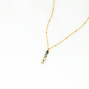 Single gold filled satellite chain with 4 birthstones from top iolite, blue topaz, moonstone and clear. 